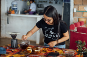 Yessica Parra, fourth-generation coffee grower and founder of Diwan Coffee, cupping coffee at her roastery in Pitalito, Colombia