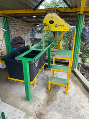 Yellow Penagos depulping machine for semi-washed coffee processing at Andres Martinez El Sendero farm in Cauca Colombia