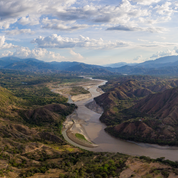 Cauca Colombia coffee region landscape showing river valley and mountains at 1750 meters altitude where El Sendero farm produces Gesha coffee