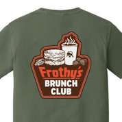 Frothy's Brunch Club T-shirt, a biscuit sandwich, bacon and steaming coffee cup above a retro sign, printed on the back of a sage green Comfort Colors shirt