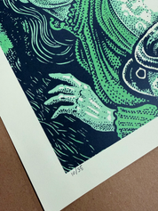 Close-up of the hand-written edition number 10/35 on the poster's bottom margin