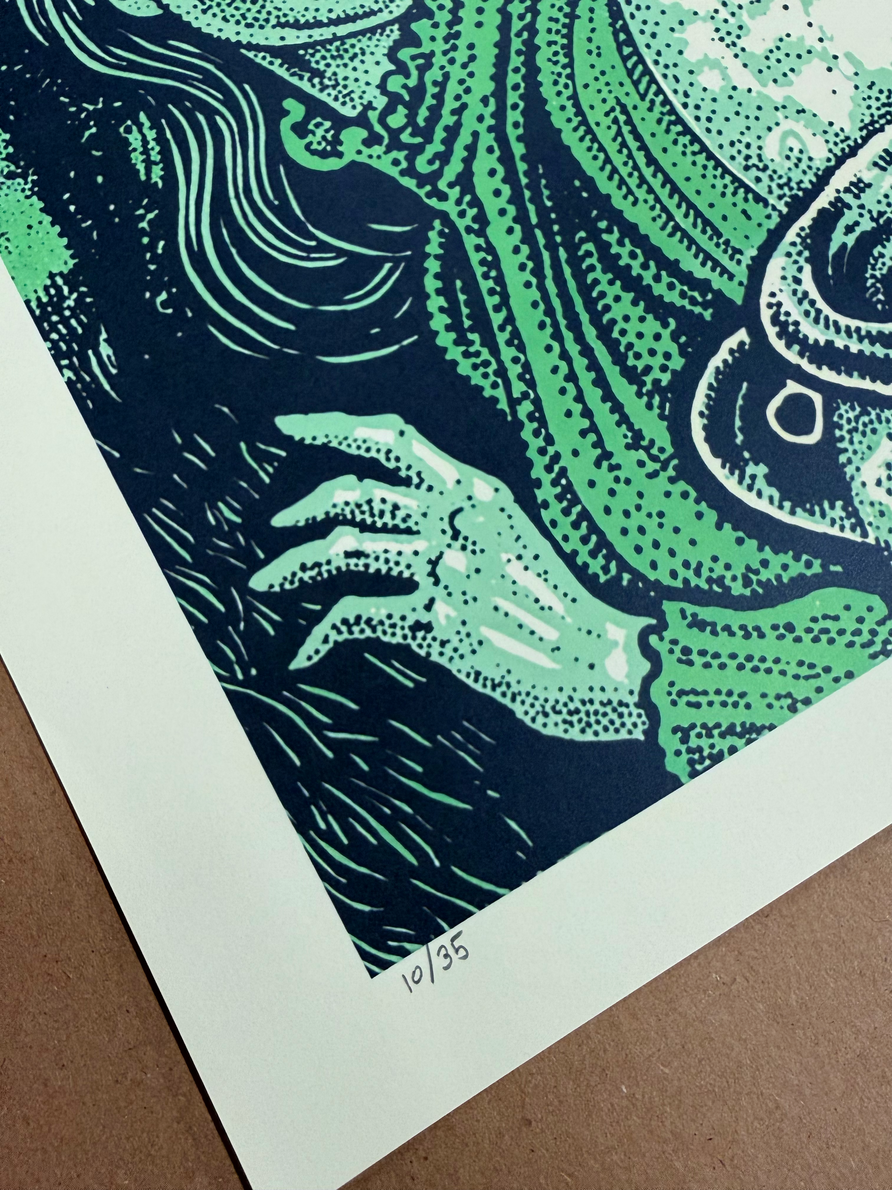 Close-up of the hand-written edition number 10/35 on the poster's bottom margin