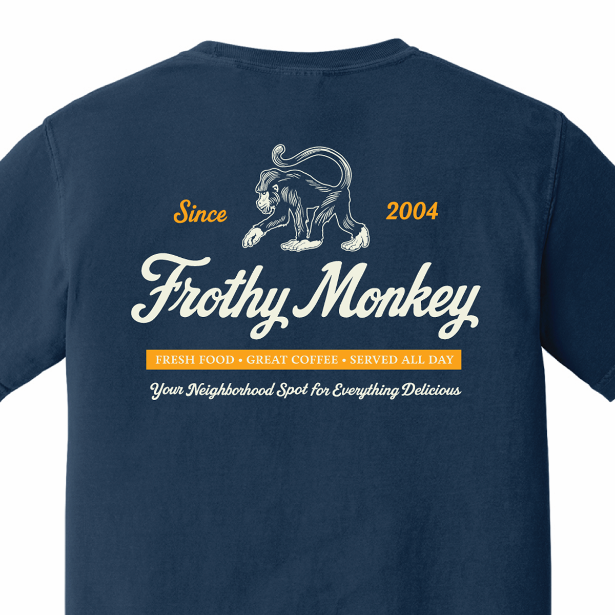 Back of the Frothy Monkey vintage logo tee in True Navy, cream monkey and script logo above a marigold Fresh Food, Great Coffee, Served All Day banner