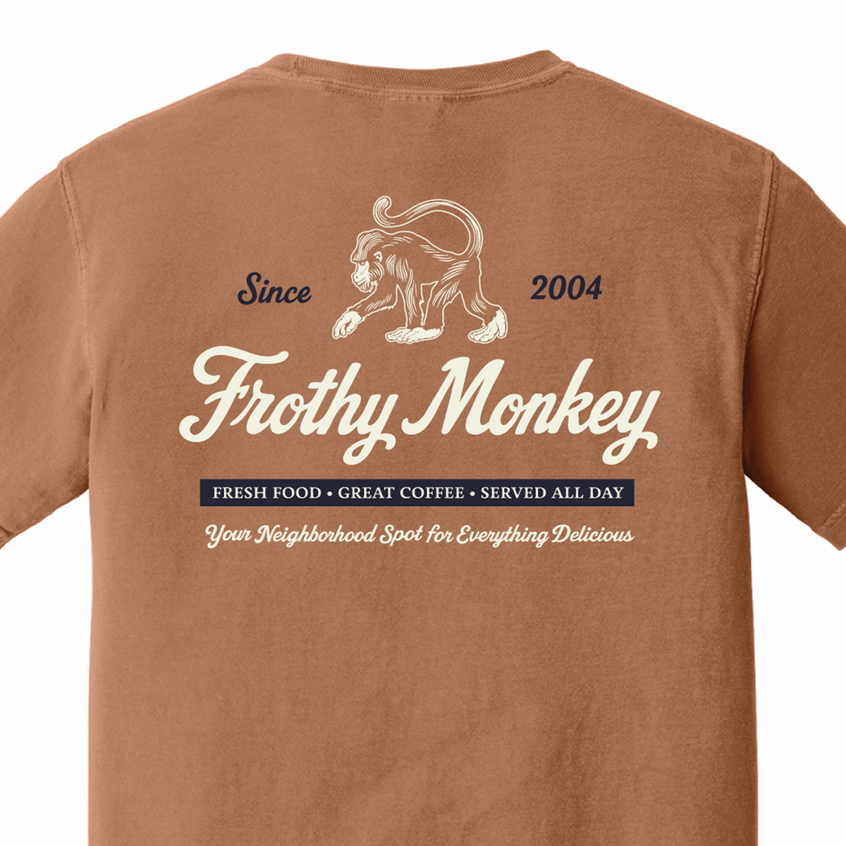 Back of the Frothy Monkey vintage logo tee in Yam, cream monkey and script logo above a navy Fresh Food, Great Coffee, Served All Day banner
