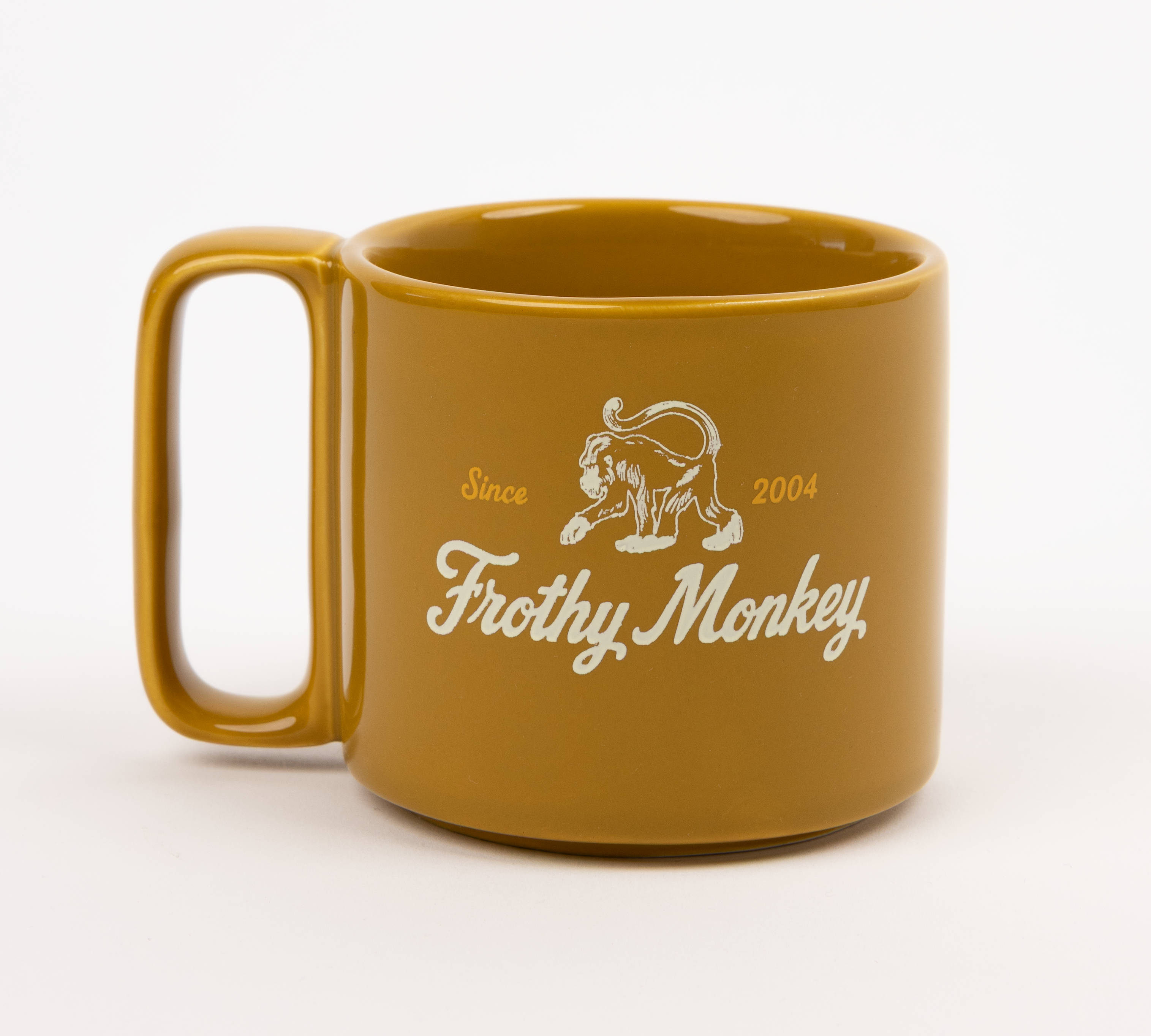 Single Frothy Monkey 10 oz stackable ceramic mug in Chai with vintage logo in cream and Brunch Yellow accents, side view