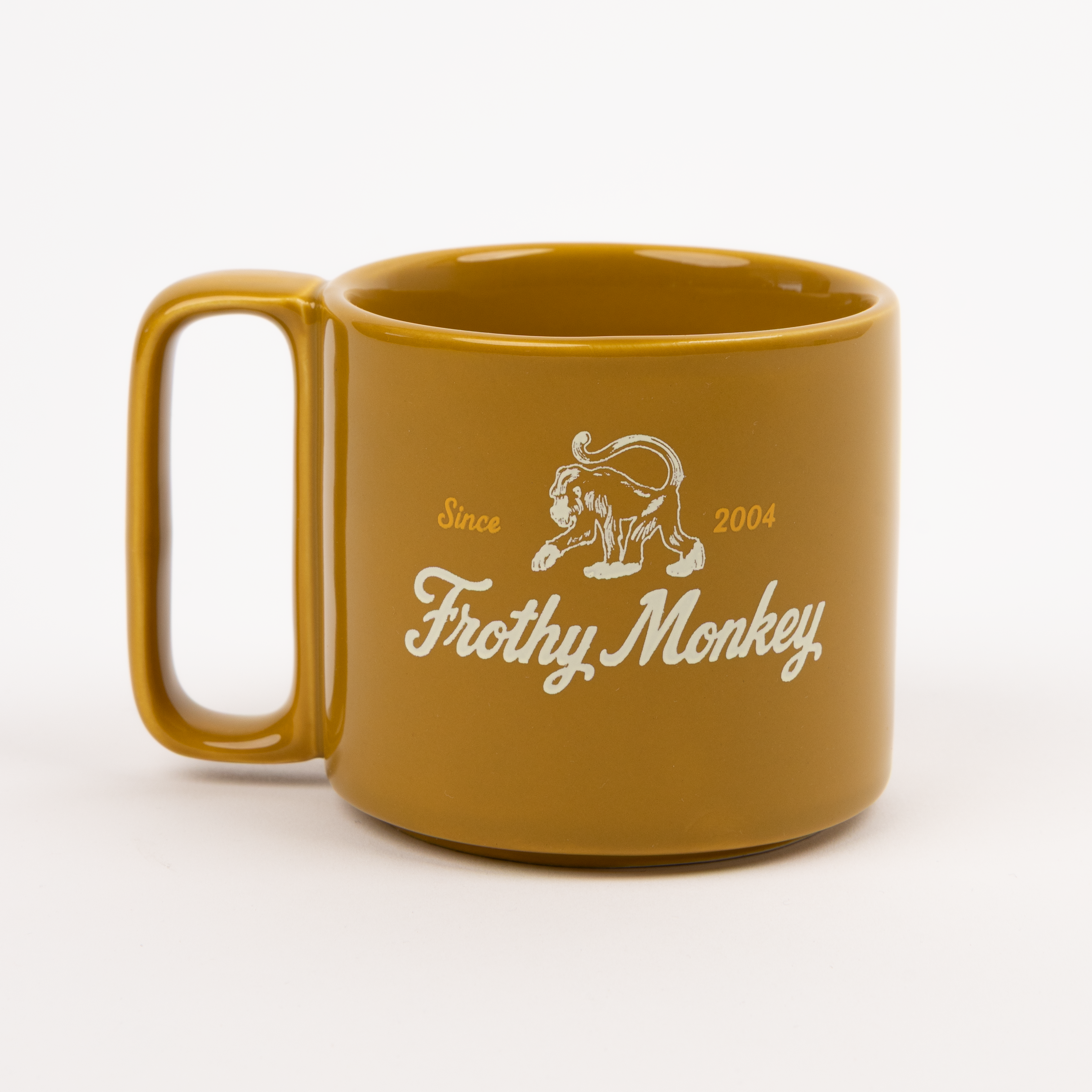 Single Frothy Monkey 10 oz stackable ceramic mug in Chai with vintage logo in cream and Brunch Yellow accents, side view