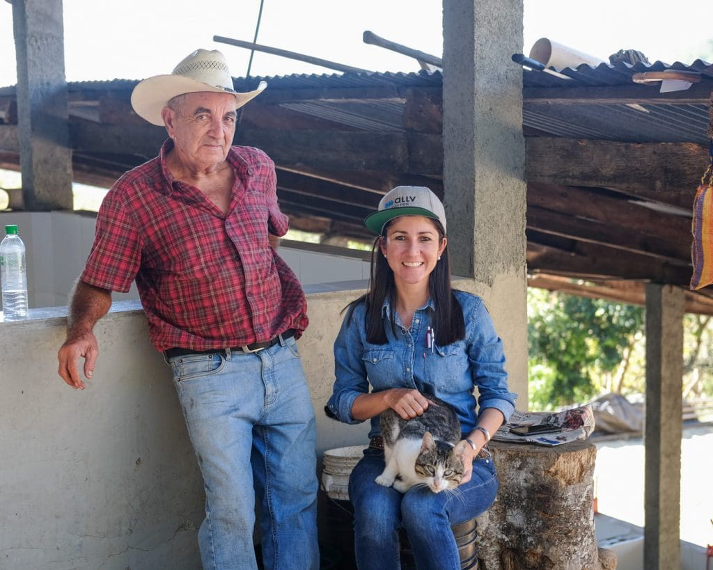 Katia Duke with her father and a farm cat at San Isidro, the family coffee farm in Copán, Honduras